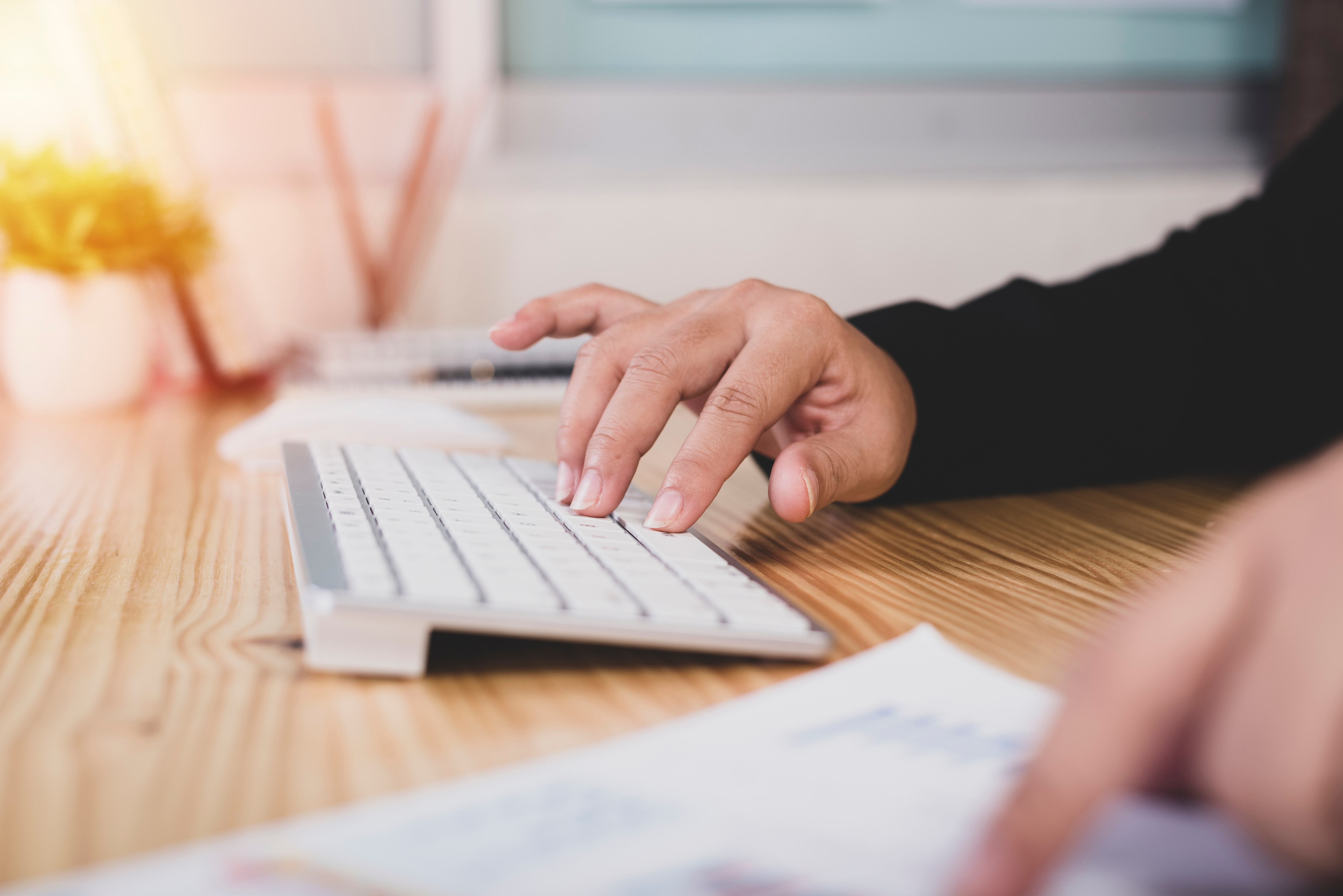 Asian business woman hands of an office worker woman typing keyboard.Financing Accounting Banking Concept.